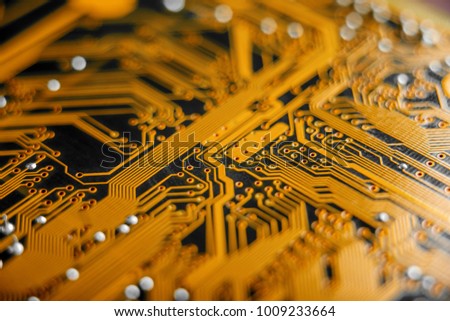 Electronic Board with the lines and chips, semiconductor elements closeup. The concept of the technology of solid-state microelectronics Royalty-Free Stock Photo #1009233664