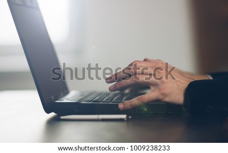 office worker working on laptop