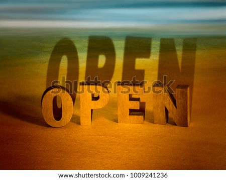 open sign word wooden letters on sky background