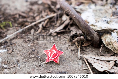 icon hammer and sickle and star on the snow-covered ground