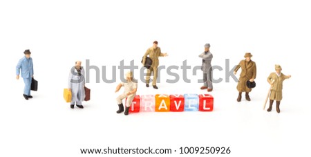 Miniature people. Tourism and travel concept with letter "TRAVEL" on white background.