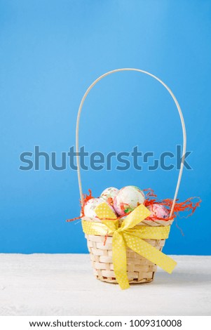 Image of basket with colorful eggs