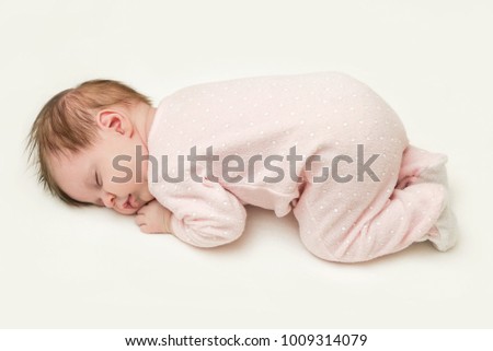 Portrait of adorable newborn baby girl sleeping