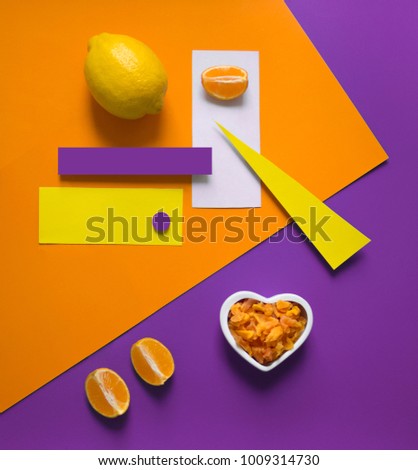 lemon orange on a bright background purple yellow orange triangle circle rectangle geometry heart dried fruits candied fruits