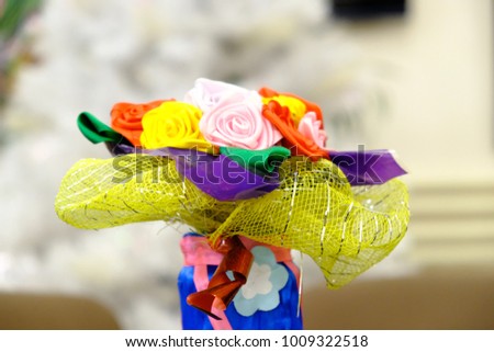 Paper roses on a white background.