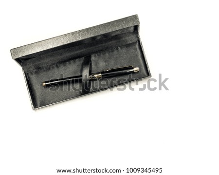 black shiny fountain pen in a box isolated on white background