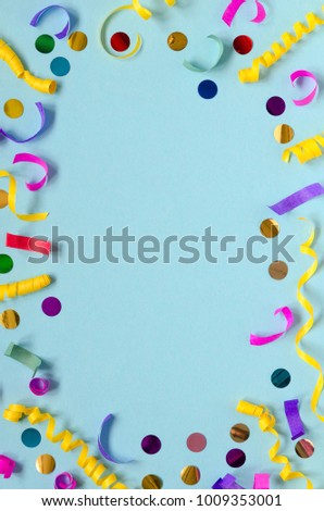 Carnival festive decoration on blue background. Copy space composition. Overhead shots. Frame.