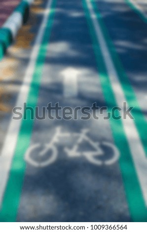blur background safety green bicycle lane on road