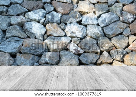 Stone wall texture background surface natural color, with white wood terrace and world map