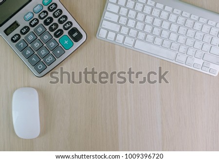 office desk and calculator wooden table