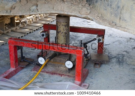 Soil bearing capacity test by Plate load test during applied force and settlement reading Royalty-Free Stock Photo #1009410466