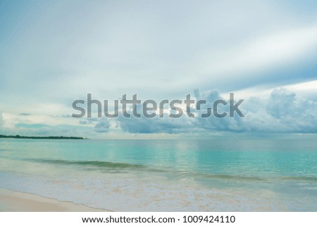 Caribbean laser sea with small waves and clouds
