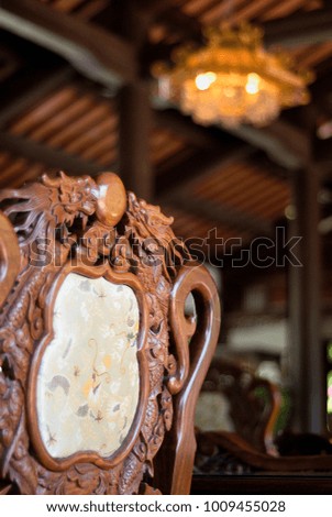 Antique wooden chair with dragon shape carving