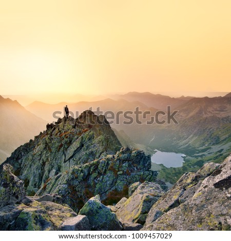 Man on the top of the hill in mountains. Photo with edit space. High Tatras, Slovakia