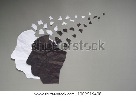 Bipolar disorder presented by human head made from black&white crumpled paper torn on gray background w/ copy space. Manic and depress emotion. Mental health, brain disorder and psychological concept. Royalty-Free Stock Photo #1009516408