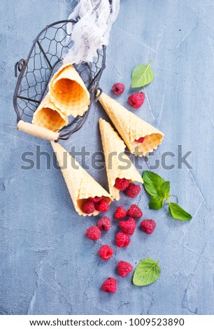 Berries and ice cream cone, stock photo
