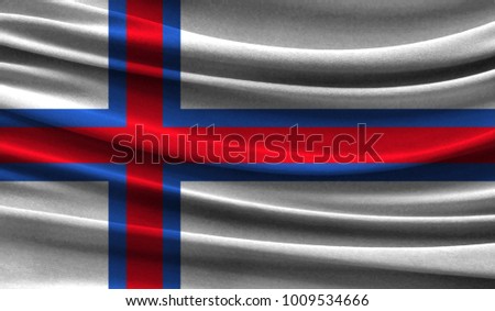 Realistic flag of Faroe Islands on the wavy surface of fabric