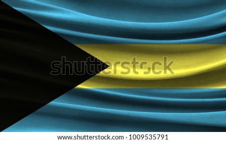 Realistic flag of Bahamas on the wavy surface of fabric. This flag can be used in design