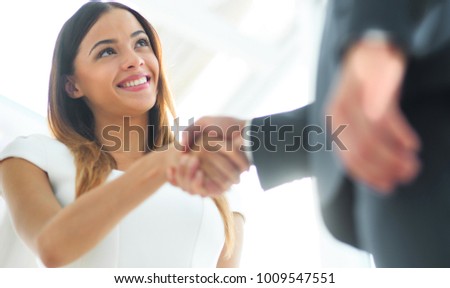 Business woman shaking hand to her partner