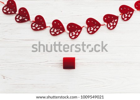 stylish red hearts with gift on white rustic wooden background flat lay. space for text. happy valentines day present. valentine's day concept. greeting card. birthday or wedding