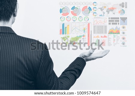 Asian business man open palm with marketing chart infographics digital data in hand