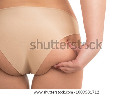 Oversize female pinching skin on her butt for test