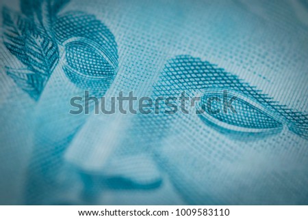 Super macro closeup on Brazilian money one hundred bill Royalty-Free Stock Photo #1009583110