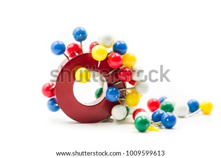 circle magnet attracting paper pins isolated on white