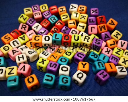 Soft focus of Colours word on colourful alphabets