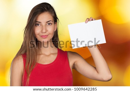 Smiling business woman handing a blank business card 