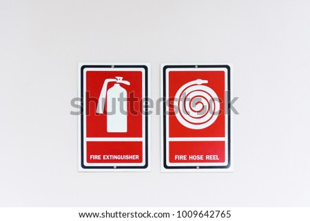 Fire hose reel sign on white wall.Thailand