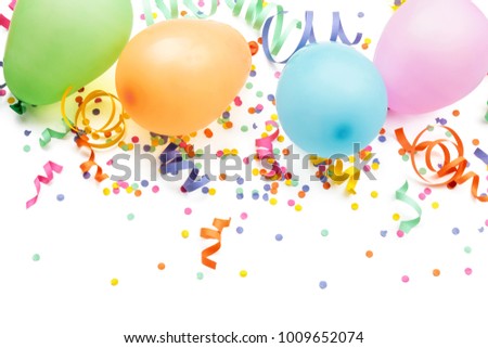 Noisemakers, streamers and confetti. Isolated on white background.
