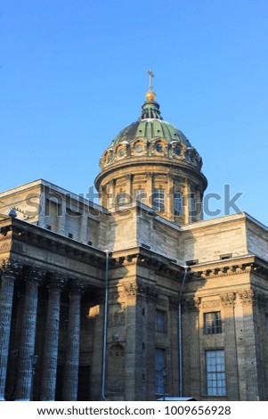 Kazan Cathedral Building in Saint-Petersburg, Russia. Active Orthodox Cathedral and Museum, Famous Cultural City Landmark. Building Close Up with Dome Stone Colonnade on Blue Sky.