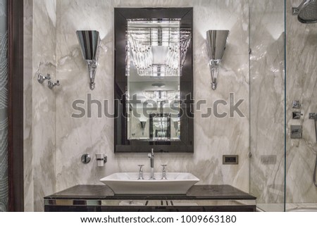 cozy and bright bathroom interior with 	marble walls and floor