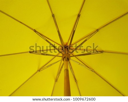 Under long-handled umbrella. vintage umbrella in thailand.