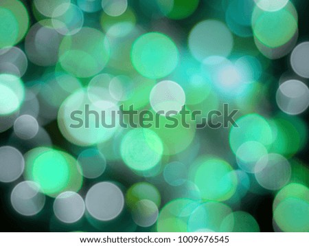 Green and white glowing blurred soft beautiful lights abstract background