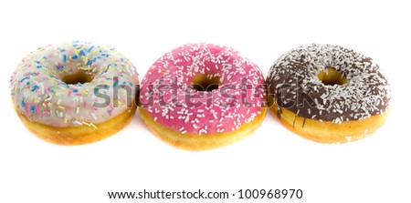 Picture of three donuts with chocolate, strawberry and vanilla frosting