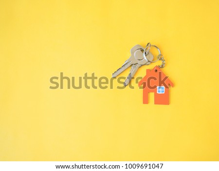House on yellow background. Minimal creative style.
 Royalty-Free Stock Photo #1009691047