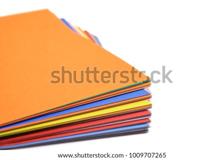 Colourful paper on white background with copy space for office and school stationary concept