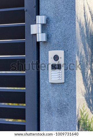 Video intercom in the entry of a house, technology and security background