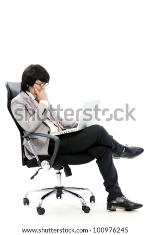 young business man using new laptop and thinking