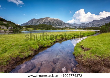 Pirin mountains/ Magnificent summer panoramic view of the Muratovo lake and Todorka peak in Pirin Mountains Royalty-Free Stock Photo #1009774372