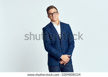  business man with glasses on a bright background                              