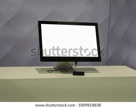Computer Monitor with Blank White Screen on table.