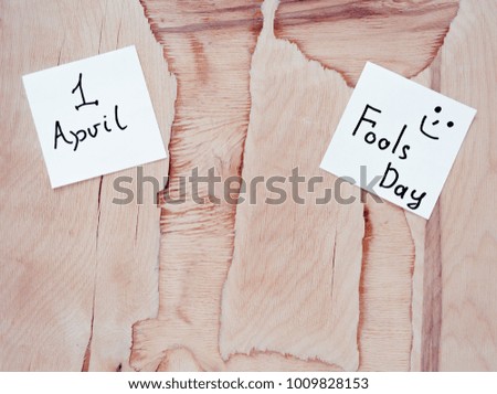 inscription on April 1, fools day on a wooden background