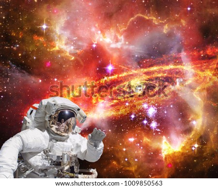 Astronaut waves. Waving in space. The elements of this image furnished by NASA.