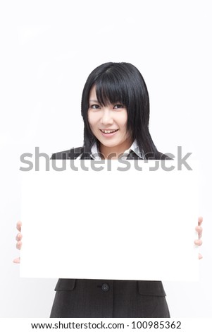 Young woman showing blank billboard