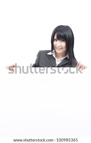 Young woman showing blank billboard, isolated on white background
