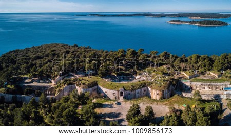 Aerial shot of an old Austro-Hungarian fort situated in Croatia near the town of Pula. The fort is overseeing the Briuni national park archipelago.