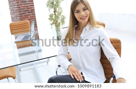 portrait of modern business woman sitting on a chair